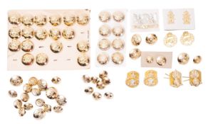 A collection of various regimental buttons and badges.