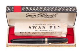 A Mabie Todd Swan Calligraph fountain pen. In black with gold trim and 14ct nib, in original box.