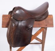 A Lovett & Ricketts 17 inch Havana brown leather saddle