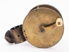 A brass 4 inch four bar reel, unsigned with polished bone handle and top clamp.