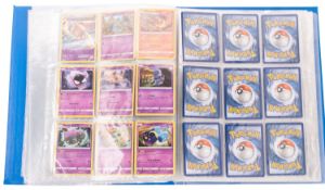 A collection of 2015 and later Pokemon cards in a blue binder.