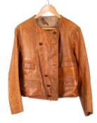 An early 20th century brown leather motoring jacket, maker Broadmotor Brand,