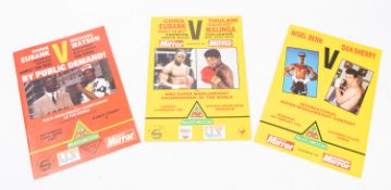 A group of three boxing programmes, together with two framed boxing prints by H M Bateman.