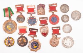 A collection of WWII era medals and coins.