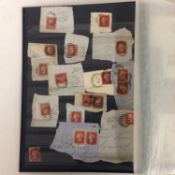 A collection of stamps and postal history covers in a green stock book.