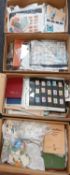 Large accumulation of world stamps in four boxes.