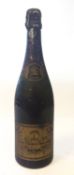 A bottle of Cliquot Ponsardin Brut Champagne 1964. Fill level to low shoulder, no qty or vol shown.
