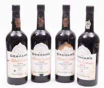 Four bottles of Grahams Malvedos Centenary 1990 Vintage Port, in an associated wooden case.