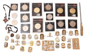 A collection of various regimental buttons and badges together with a small collection of Royal