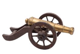 A scale brass model of a cannon,