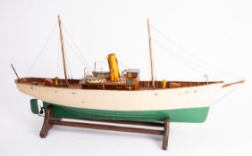 An early 20th century scale model of a steam yacht, with rigged masts,