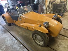 A 1968 Lotus Super Seven Series III, registration VYK 96G, bronzed yellow with flared arches, 31.