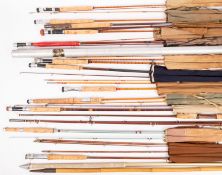A mixed collection of vintage fishing rods.