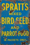 A Spratts Mixed Bird Seed and Parrot Food enamel sign.
