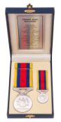 A Malaysian Pingat Jasa Medal, miniature and bar. In original box of issue.