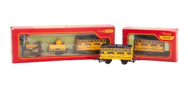 A Tri-ang Hornby OO/HO Stephensons Rocket locomotive. Together with two coaches, one boxed.