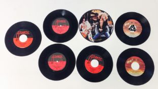 A group of seven Led Zeppelin 45 rpm records.