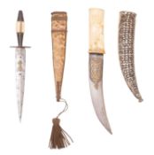 An Indian kindjall style dagger, the curved single edge blade with inlaid brass script to ricasso,