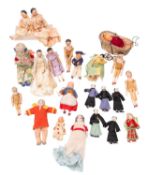A collection of nine early 20th century Dolls house size peg dolls,