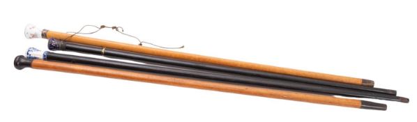 A late 18th century French Saint Cloud soft paste porcelain topped ebonised walking cane,