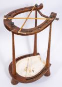 A 20th Century turned wooden stick stand in the form of a horseshoe.