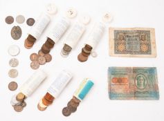 A collection of Worldwide coins including British tins, tubes and folders etc.
