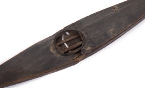 A 19th model of an Inuit canoe, of wood and paper construction with bone runners to fore and aft,