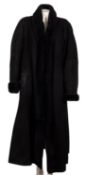 A ladies black full length sheepskin overcoat by Bettina.