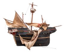 An early 20th Century carved model of an English Galleon.