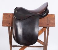 A G.T Palmer 16.5 inch Havana brown leather show saddle.
