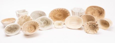 A group of fifteen early 20th century earthenware jelly moulds, various makers and designs,