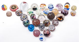 A group of thirty-two mixed glass paperw