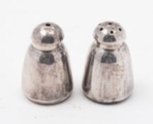 A pair of small silver salt and pepper p