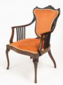 An Edwardian mahogany salon chair. The s