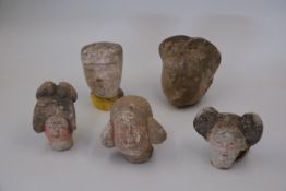A Group of Five Painted Pottery Heads, Han dynasty and Tang dynasty