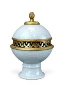 A Celadon Stembowl and Cover carved with Lotus, six character mark of Qianlong