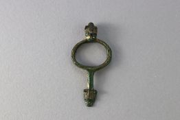 A Norman Medieval gilt-bronze fitting with beast heads, ca. 12th to 14th century AD.