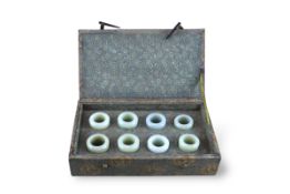 A Collection of Eight Jade Archer s Rings, 19th/20th century, in fitted box,