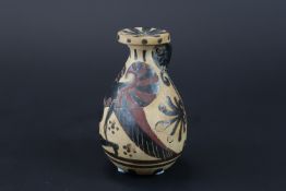 A Corinthian Pottery Alabastron, early Corinthian, Circa 620-590 B.C.