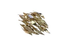 Alan Gard: A Brooch set with a Marquise Diamond, signed AMG on the pin, marked 18ct, with London hal