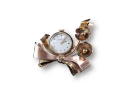 Tiffany & Co., a 1940s two coloured Gold Stylised Bow and Flower Watch Brooch