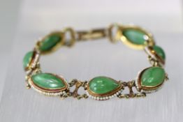 A Jadeite, Gold and seed Pearl Bracelet, circa 1910