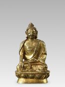 A Miniature Gilt Bronze Seated Buddha Sakyamuni, 18th century,