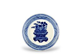 A Small Blue and White Dish with a Jardiniere, late Kangxi