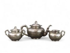 A Chinese Silver Dragon Teapot and Cover, with Milk Jug and Sugar Bowl and Cover, stamped TUCKCHANG,