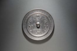 A Bronze Chinese Inscribed Mirror featuring Guardian Beasts and a Persimmon Calyx Sui Dynasty