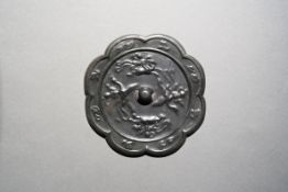 A Bronze Octafoil Mirror with Immortals riding Mythical Creatures Tang Dynasty