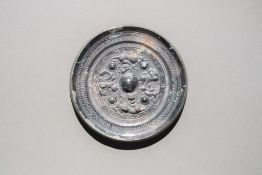 A Bronze Circular Mirror with Deities and Beasts Han Dynasty