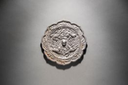 A Bronze Octafoil Mirror featuring Immortals Seated Astride Dragons Tang Dynasty