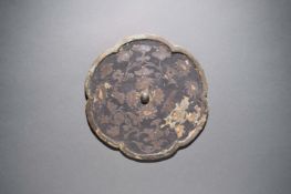 A Silver-decorated Bronze Foliate Mirror Tang Dynasty